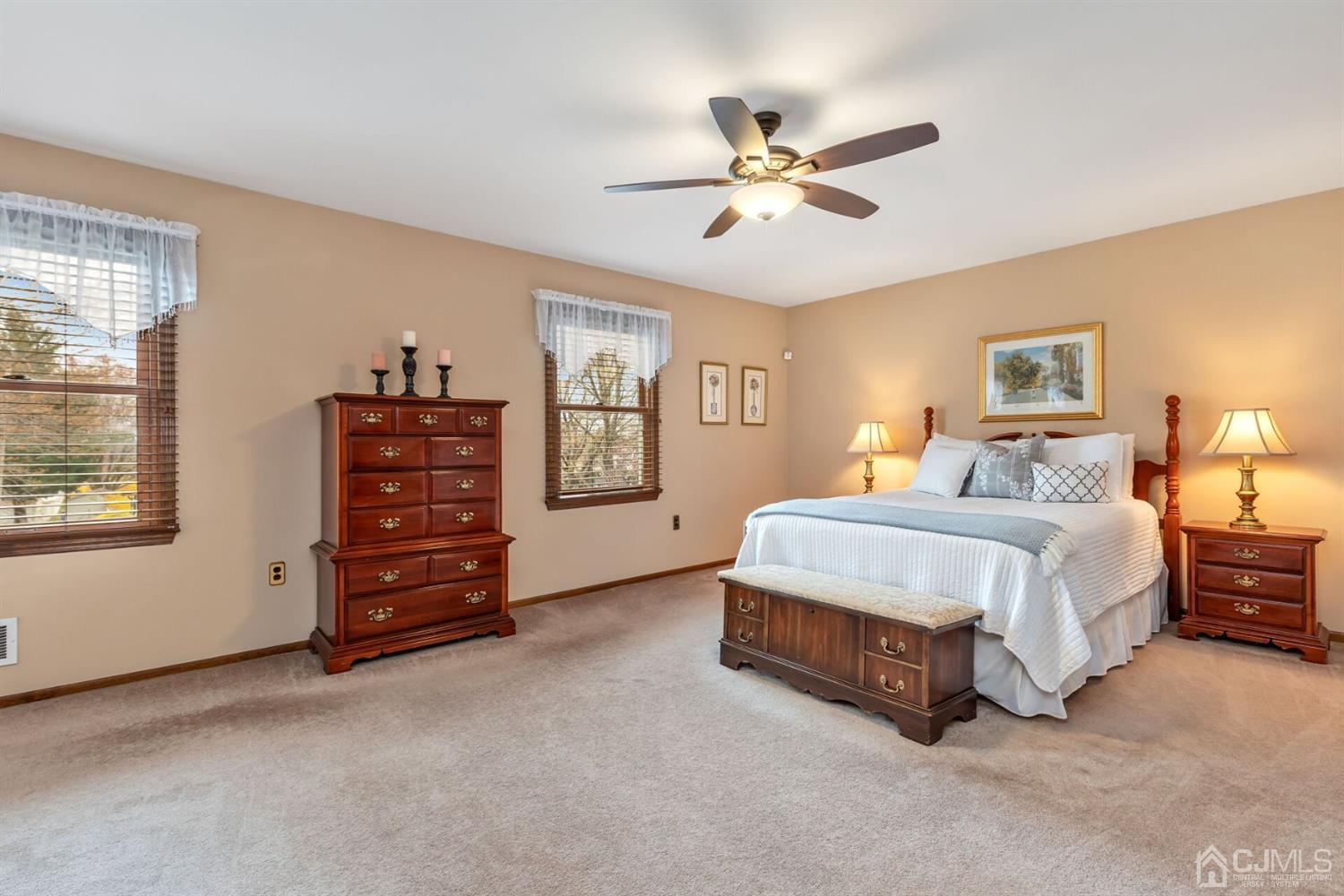 28 Harkins Road Milltown, NJ 08850 - Photo 25 of 46 a spacious bedroom with a bed a dresser and a window