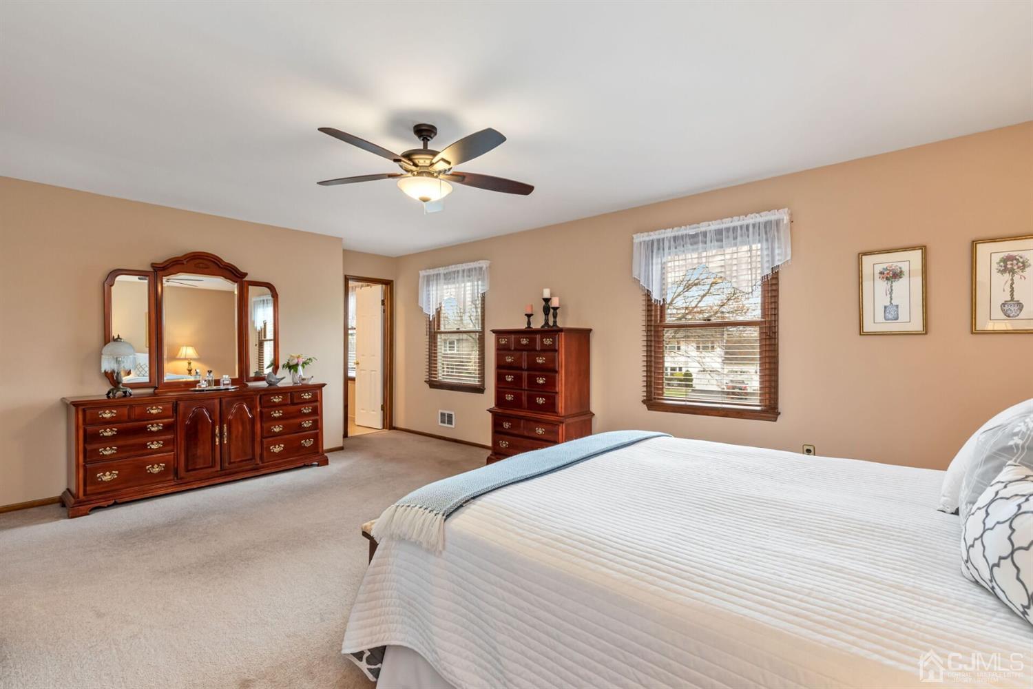 28 Harkins Road Milltown, NJ 08850 - Photo 27 of 46 a bedroom with a large bed and dresser