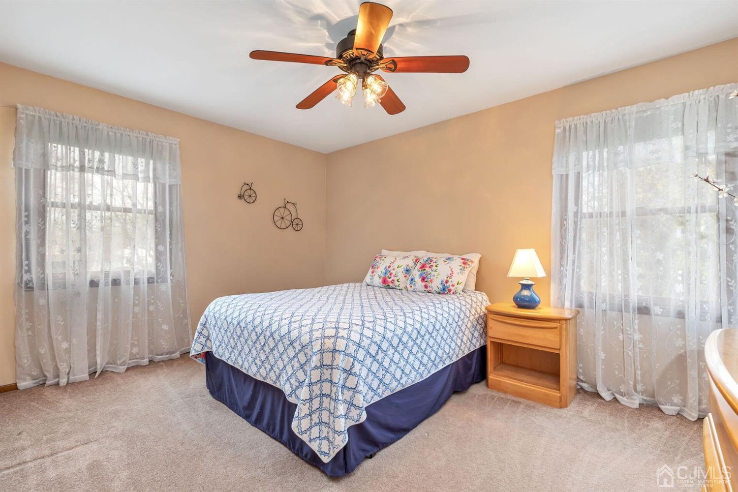 28 Harkins Road Milltown, NJ 08850 - Photo 28 of 46 a bedroom with a bed and a chandelier