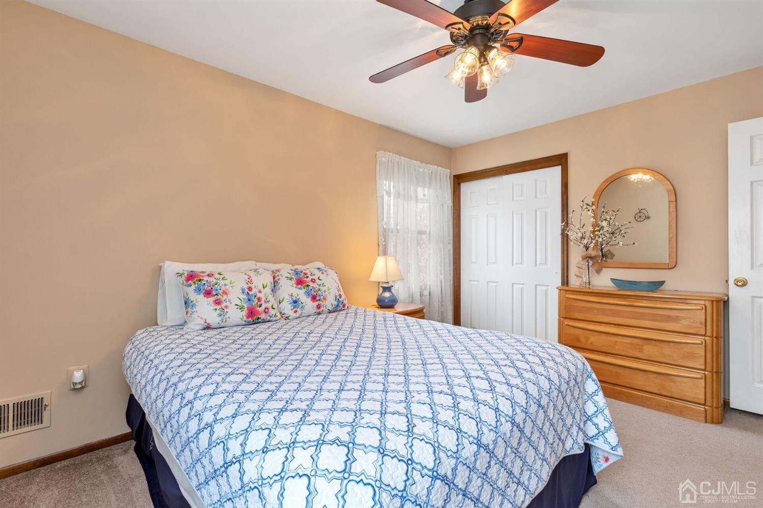 28 Harkins Road Milltown, NJ 08850 - Photo 29 of 46 a bedroom with a bed and a chandelier