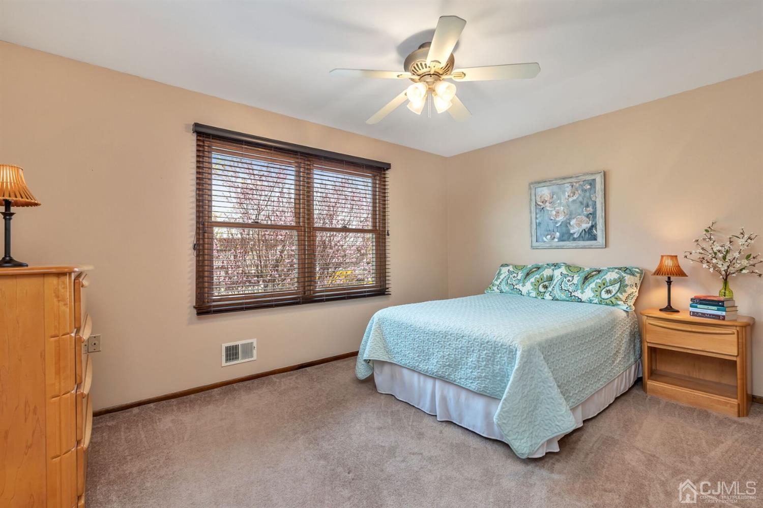 28 Harkins Road Milltown, NJ 08850 - Photo 30 of 46 a spacious bedroom with a bed and a window