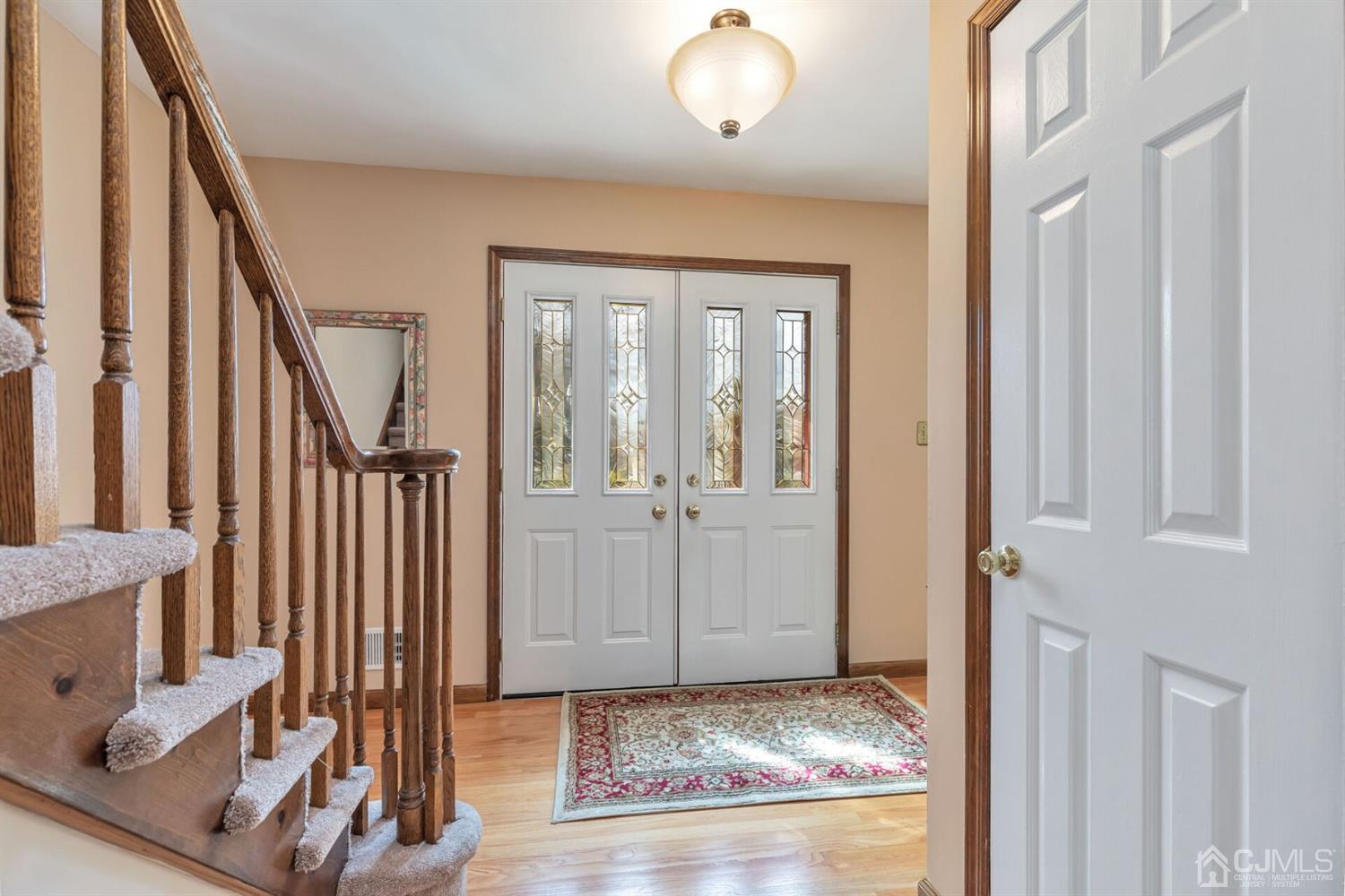 28 Harkins Road Milltown, NJ 08850 - Photo 4 of 46 a view of an entryway with wooden floor