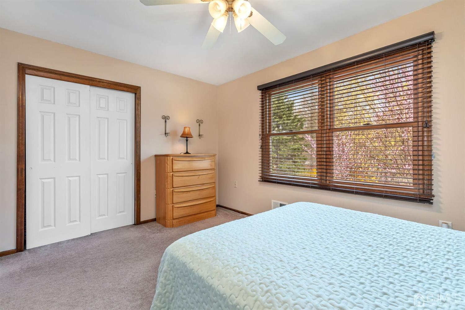 28 Harkins Road Milltown, NJ 08850 - Photo 31 of 46 a bedroom with a bed and a chandelier