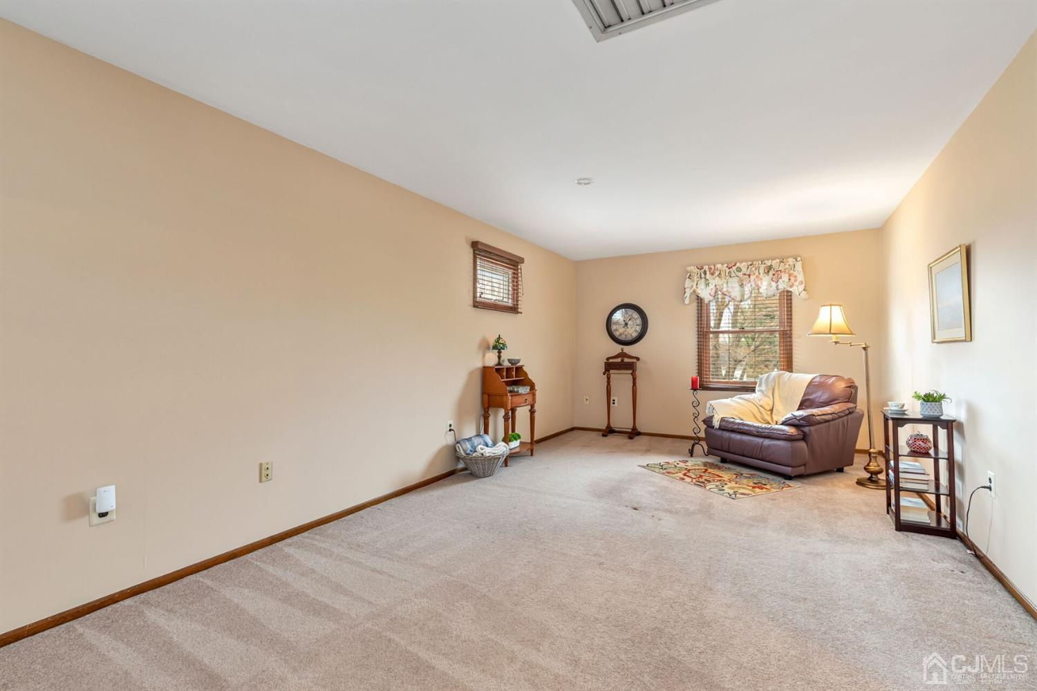 28 Harkins Road Milltown, NJ 08850 - Photo 34 of 46 a living room with furniture a window and a couch