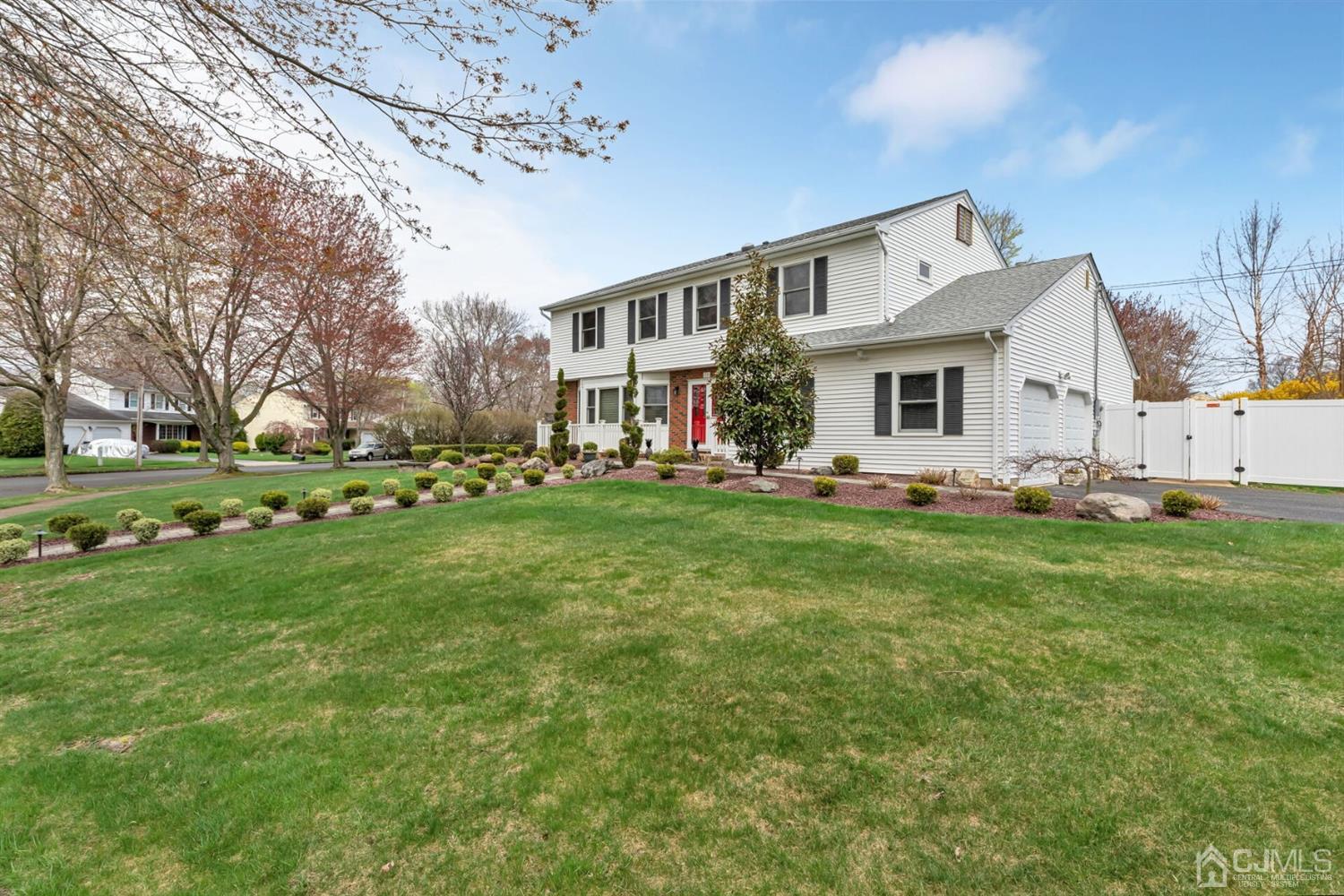 28 Harkins Road Milltown, NJ 08850 - Photo 36 of 46 a front view of house with yard and green space
