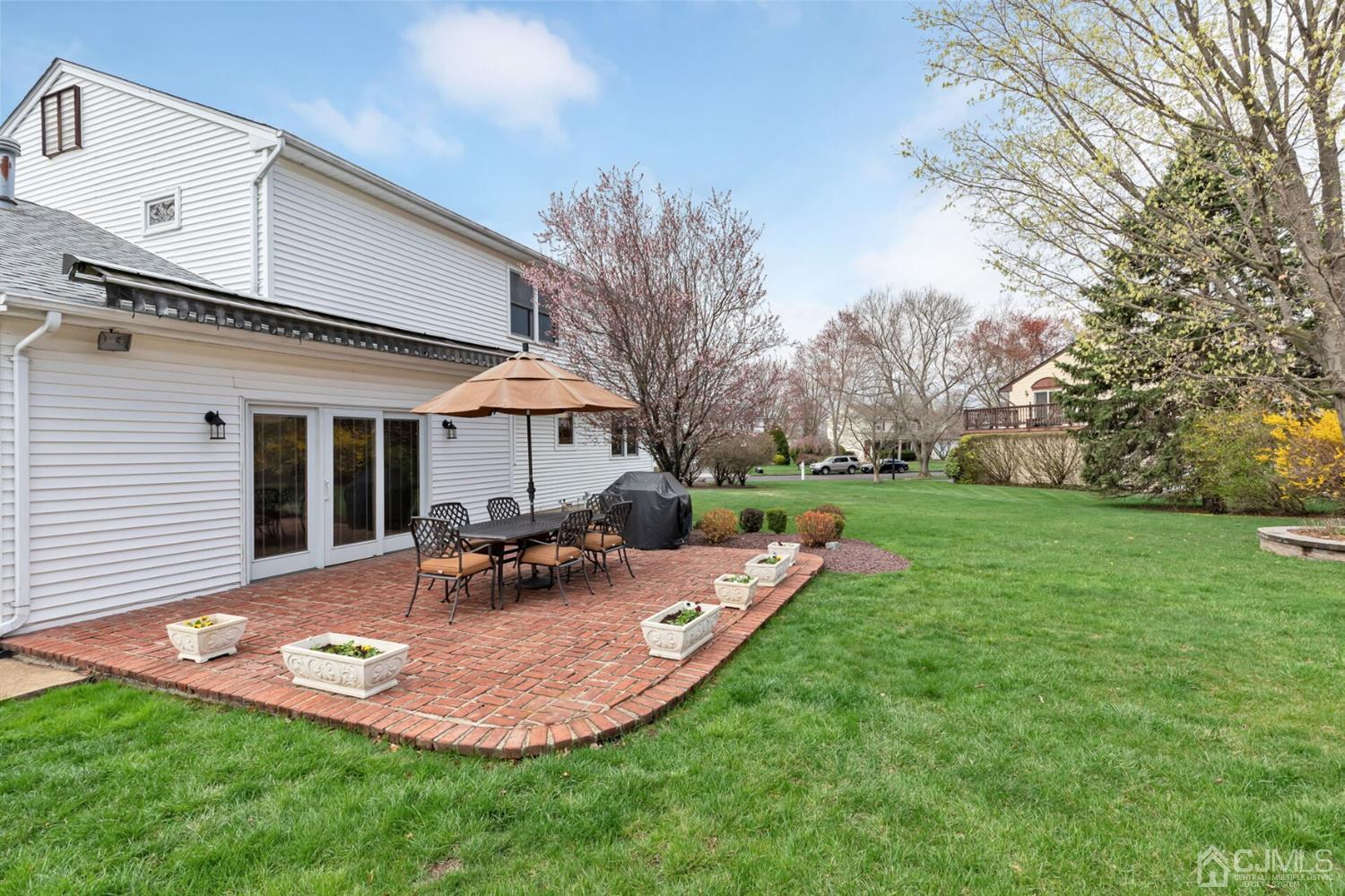 28 Harkins Road Milltown, NJ 08850 - Photo 37 of 46 a view of a house with backyard sitting area and garden