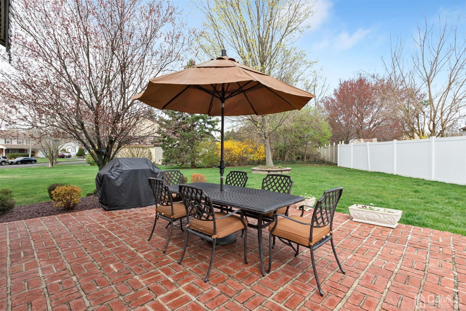 28 Harkins Road Milltown, NJ 08850 - Photo 38 of 46 a view of a table and chairs under an umbrella