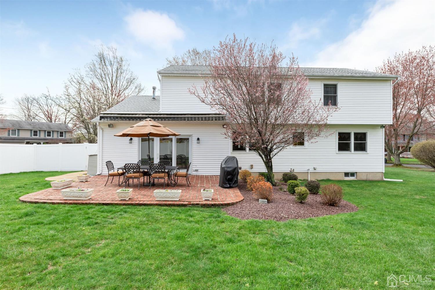 28 Harkins Road Milltown, NJ 08850 - Photo 41 of 46 a view of a house with backyard and sitting area