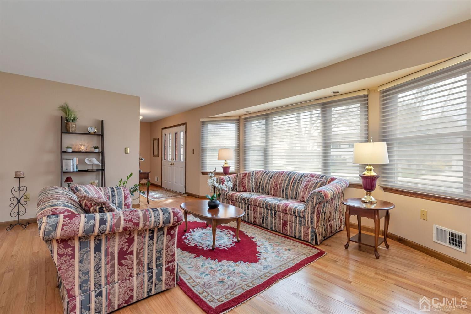28 Harkins Road Milltown, NJ 08850 - Photo 7 of 46 a living room with furniture and a window