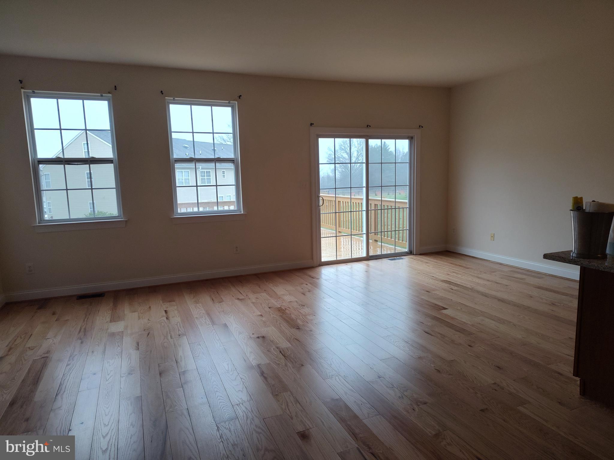 63 Sugar Maple Road Barto, PA 19504 - Photo 2 of 3 an empty room with wooden floor and windows