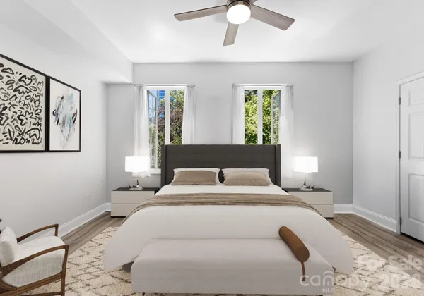 a bedroom with a large bed and a window