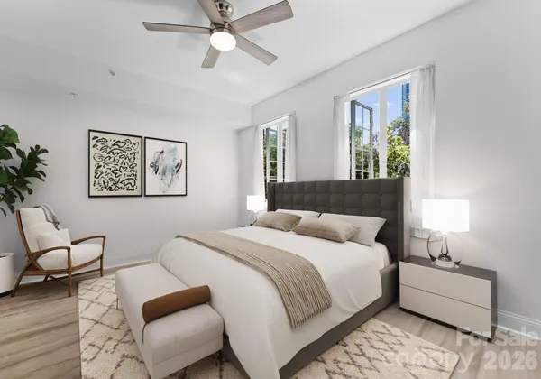 a bedroom with a large bed and a couch