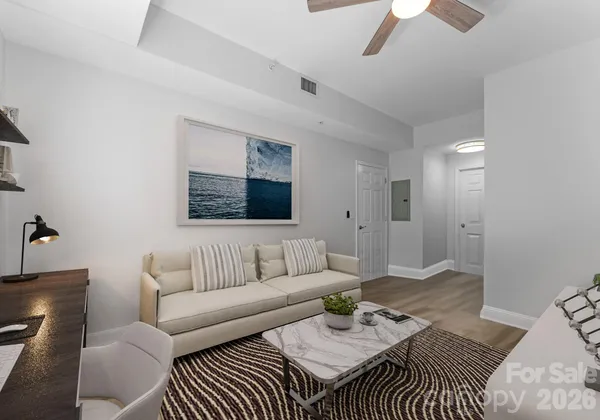a living room with furniture and a rug