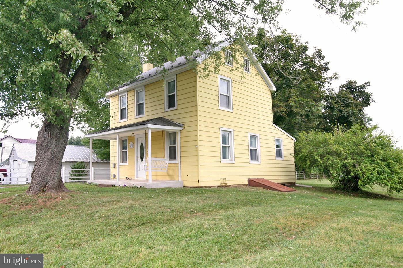 9050 New Cut Road Rocky Ridge, MD 21778 - Photo 2 of 24 a front view of a house with a garden