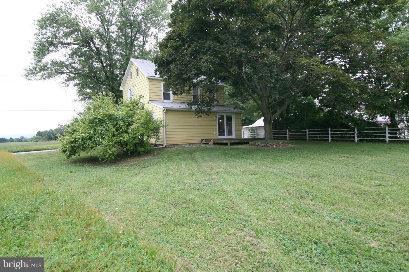 9050 New Cut Road Rocky Ridge, MD 21778 - Photo 14 of 24 a white house that has a tree in front of it