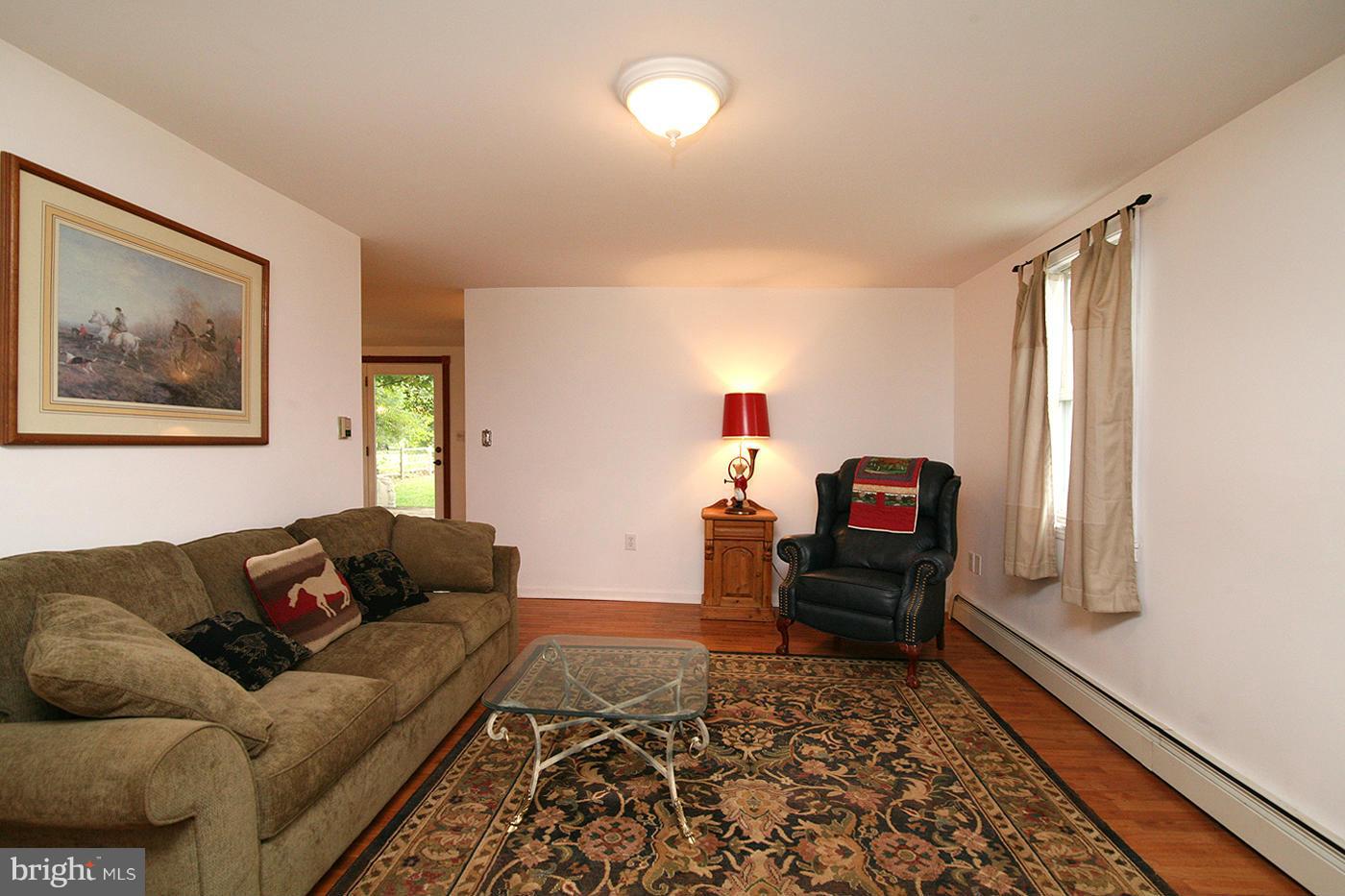 9050 New Cut Road Rocky Ridge, MD 21778 - Photo 6 of 24 a living room with furniture and a rug