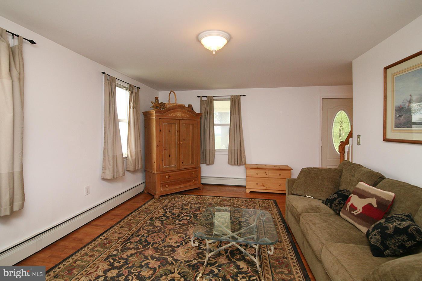 9050 New Cut Road Rocky Ridge, MD 21778 - Photo 7 of 24 a living room with furniture and a rug