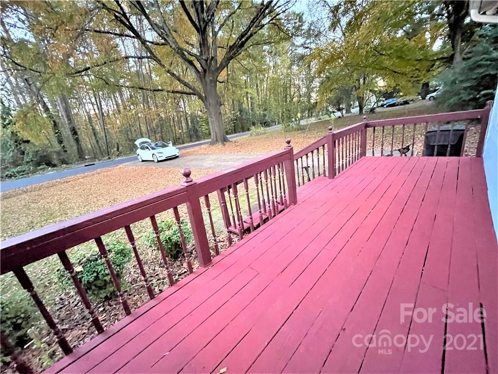 7002 Ware Road Charlotte, NC 28212 - Photo 11 of 21 a balcony with wooden floor and trees