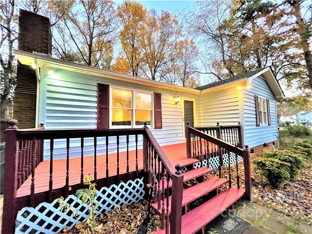 7002 Ware Road Charlotte, NC 28212 - Photo 13 of 21 a view of a wooden deck with a white house