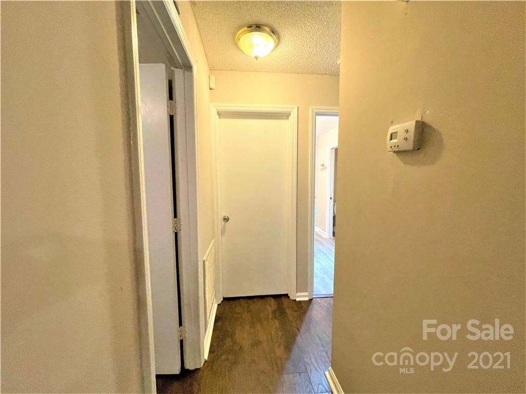 7002 Ware Road Charlotte, NC 28212 - Photo 17 of 21 a view of a hallway with wooden floor