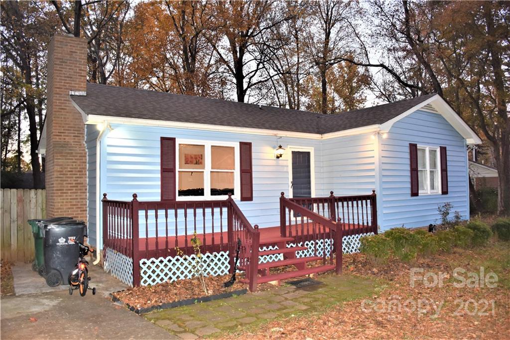 7002 Ware Road Charlotte, NC 28212 - Photo 3 of 21 a view of a house with a wooden fence