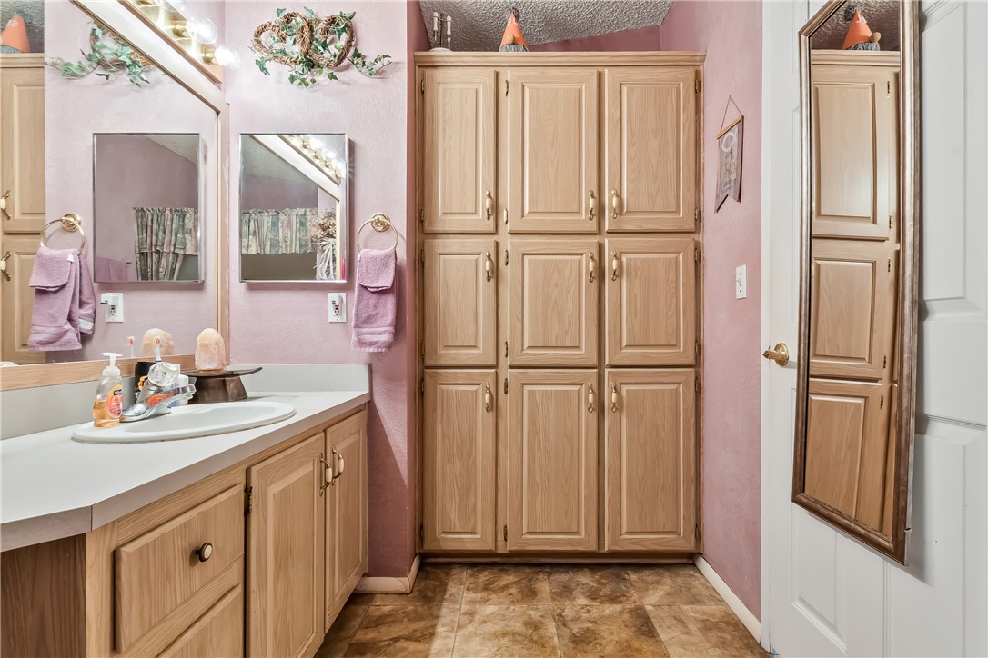 1545 East El Rodeo Road, Unit 58 Fort Mohave, AZ 86426 - Photo 24 of 47 Full bath with vanity and a textured ceiling
