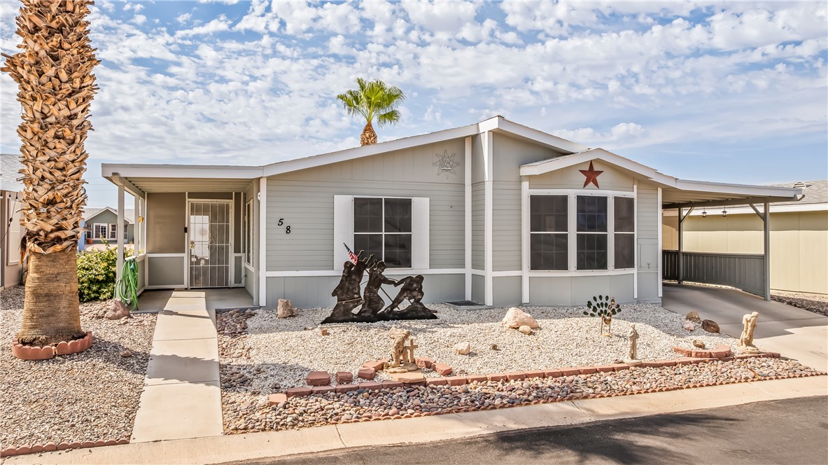 1545 East El Rodeo Road, Unit 58 Fort Mohave, AZ 86426 - Photo 38 of 47 Manufactured / mobile home featuring a carport and a sunroom