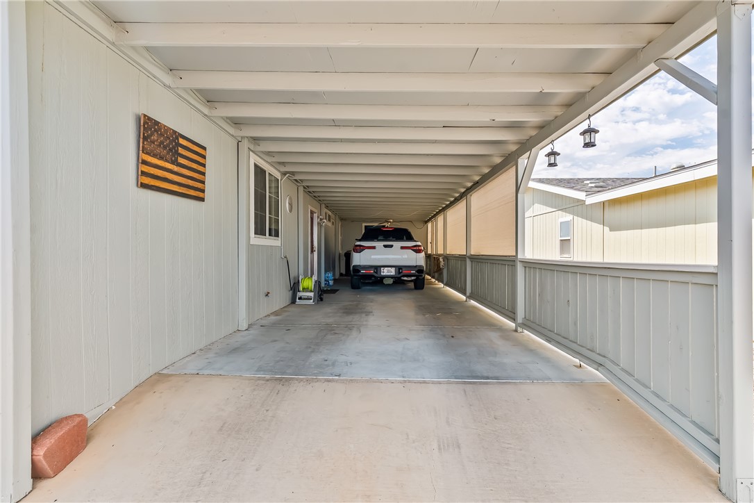 1545 East El Rodeo Road, Unit 58 Fort Mohave, AZ 86426 - Photo 4 of 47 View of parking / parking lot with an attached carport