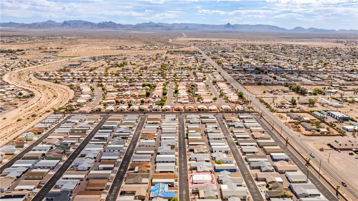 1545 East El Rodeo Road, Unit 58 Fort Mohave, AZ 86426 - Photo 47 of 47 Aerial perspective of suburban area featuring a mountainous background