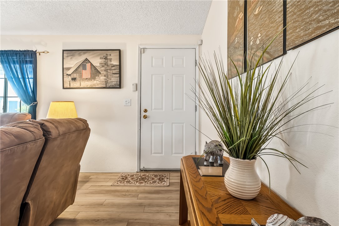 1545 East El Rodeo Road, Unit 58 Fort Mohave, AZ 86426 - Photo 6 of 47 Foyer with a textured ceiling and wood finished floors