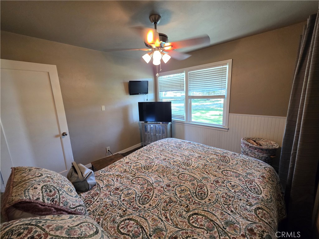 23773 River Road Corning, CA 96021 - Photo 20 of 64 a bedroom with a bed and a window
