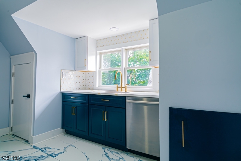 88 Hornsby Street Woodbridge, NJ 08863 - Photo 2 of 12 a kitchen with a sink and a window