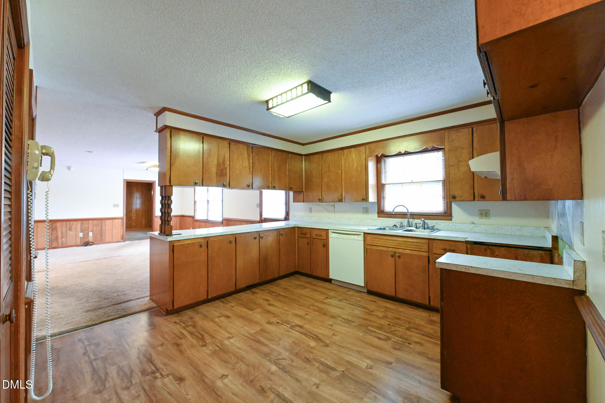 3011 Will Lucas Road Linden, NC 28356 - Photo 12 of 35 a kitchen with stainless steel appliances granite countertop wooden cabinets a sink and dishwasher with wooden floor