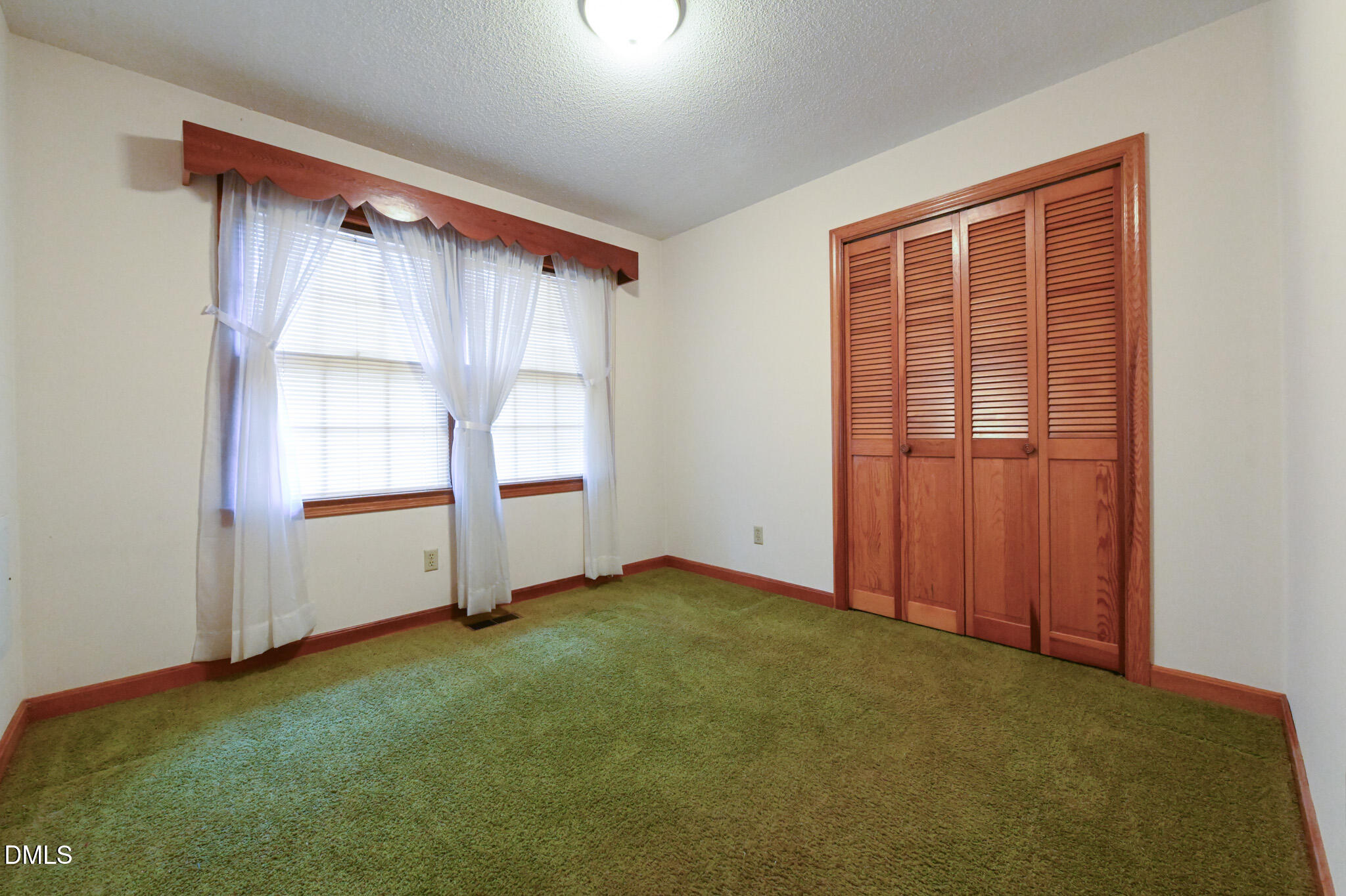 3011 Will Lucas Road Linden, NC 28356 - Photo 19 of 35 an empty room with windows
