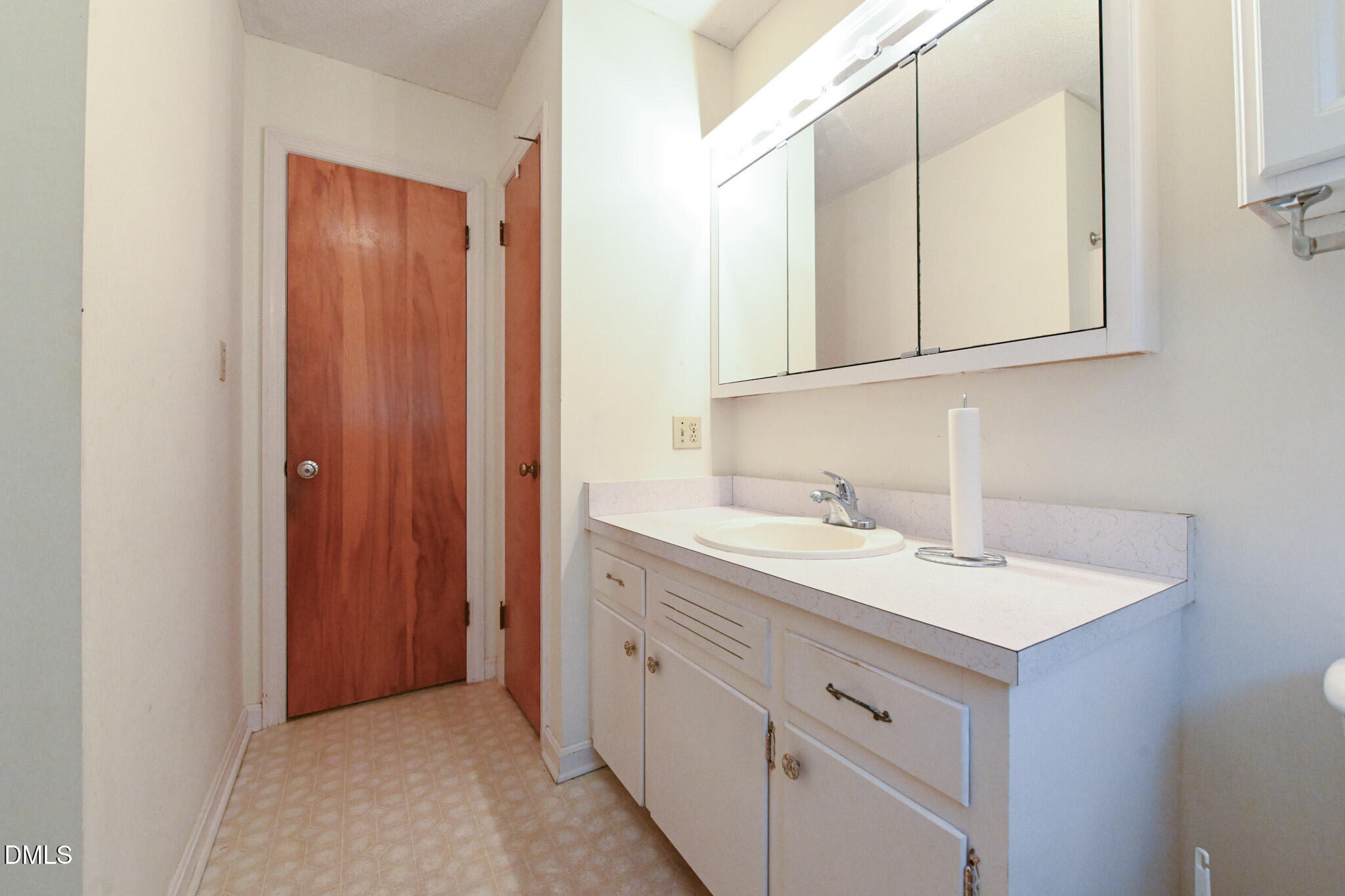 3011 Will Lucas Road Linden, NC 28356 - Photo 23 of 35 a bathroom with a sink and a mirror