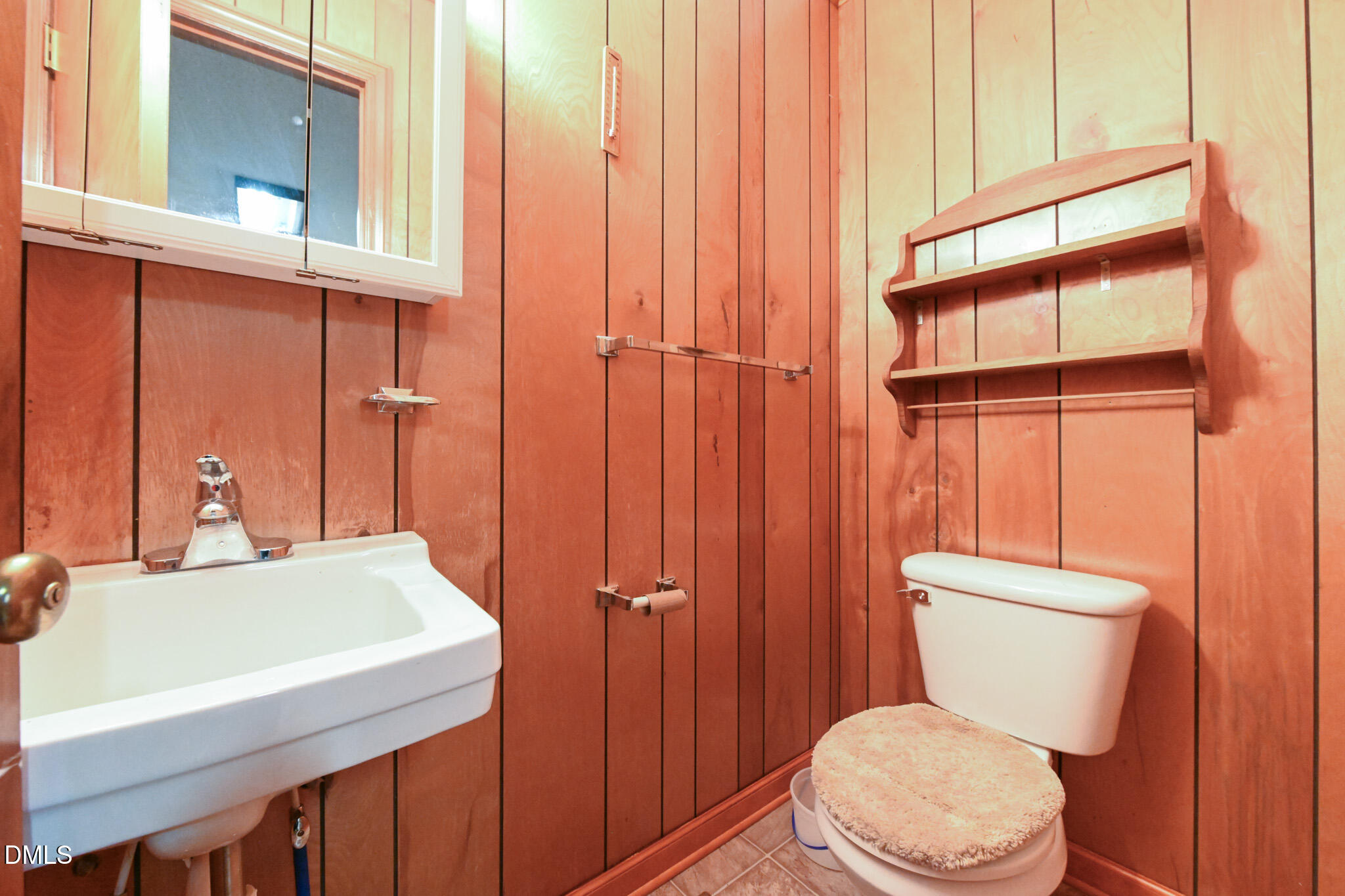 3011 Will Lucas Road Linden, NC 28356 - Photo 29 of 35 a bathroom with a sink a toilet and shower