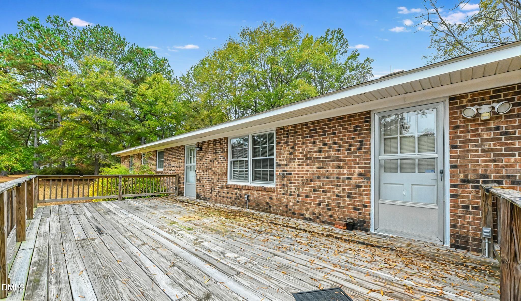 3011 Will Lucas Road Linden, NC 28356 - Photo 30 of 35 a view of house with backyard and deck