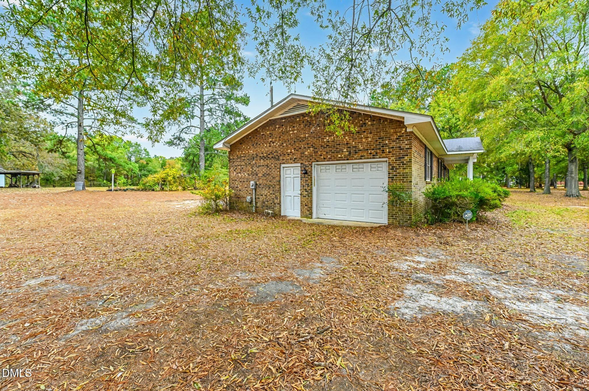 3011 Will Lucas Road Linden, NC 28356 - Photo 3 of 35 a view of an house with backyard and garden