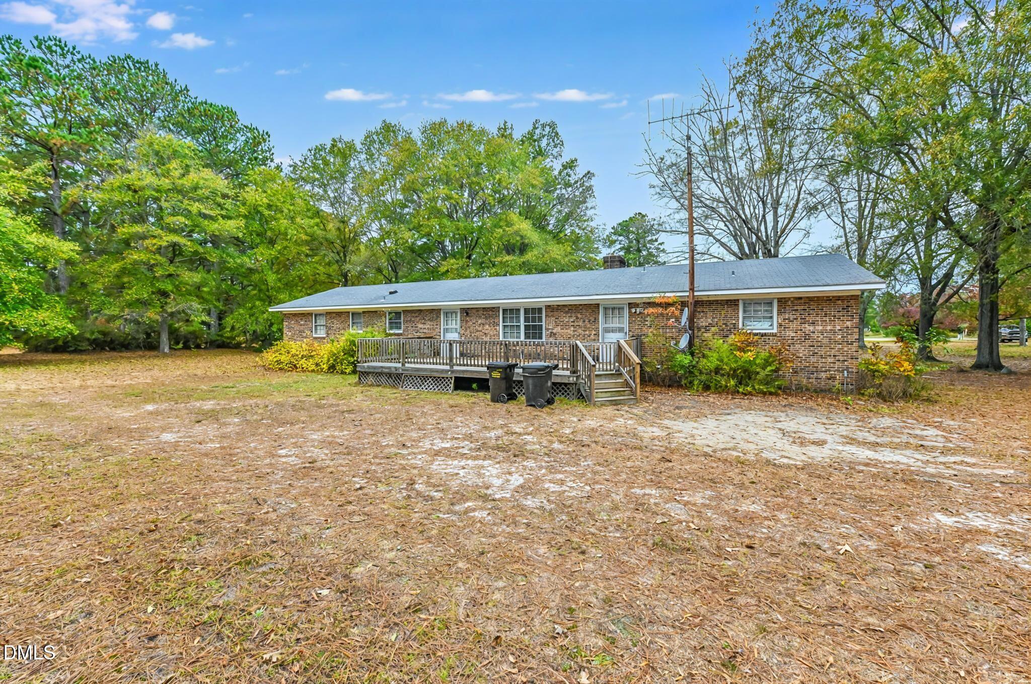 3011 Will Lucas Road Linden, NC 28356 - Photo 32 of 35 front view of a house with a yard
