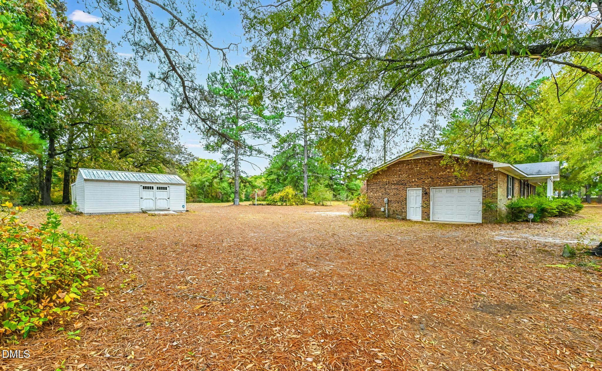 3011 Will Lucas Road Linden, NC 28356 - Photo 4 of 35 a house with a tree in front of it