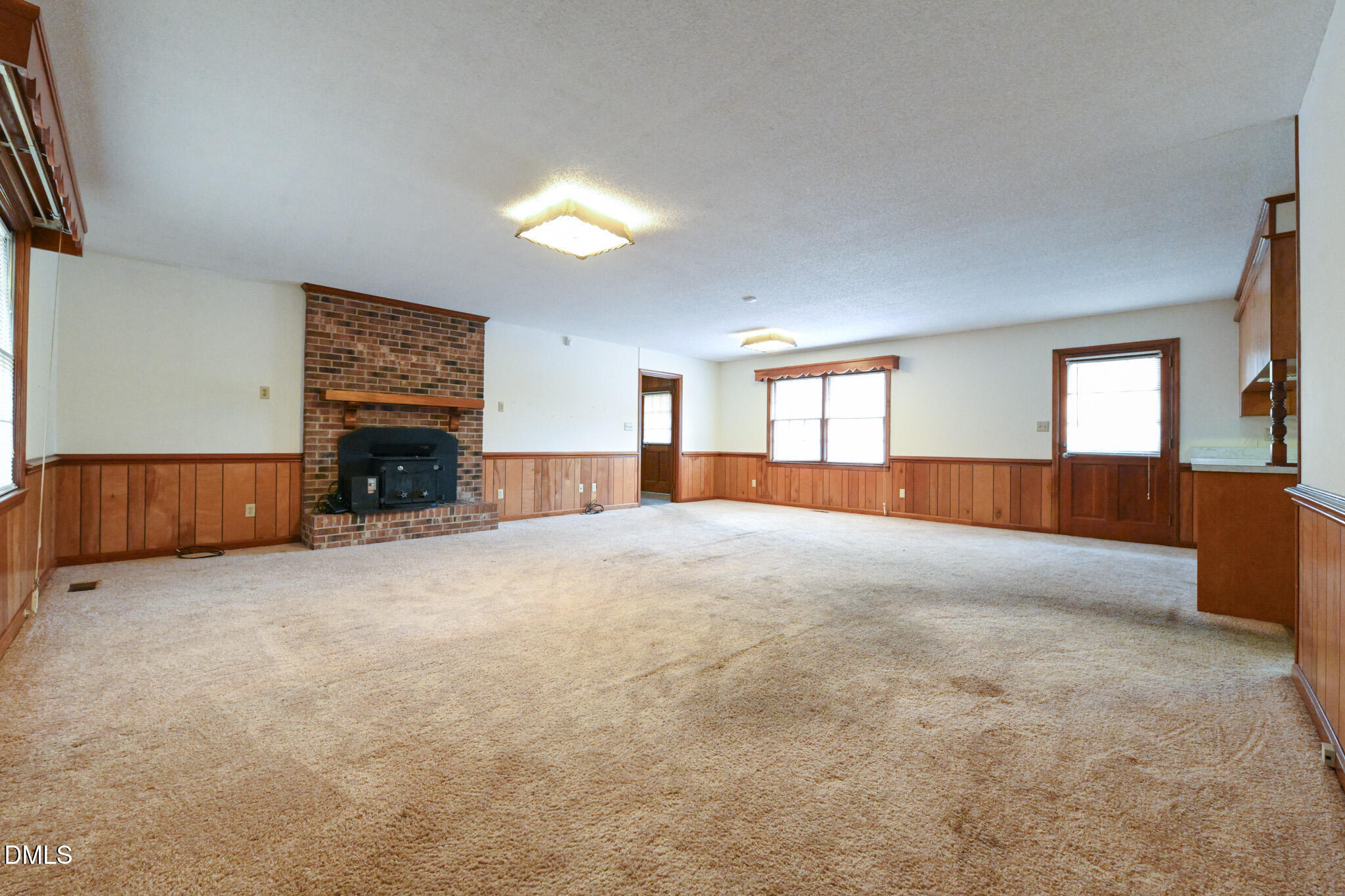 3011 Will Lucas Road Linden, NC 28356 - Photo 5 of 35 a view of empty room with a fireplace and window