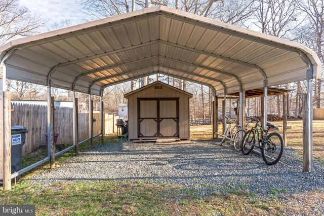 a view of road with large trees
