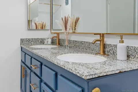 a bathroom with sink and mirror