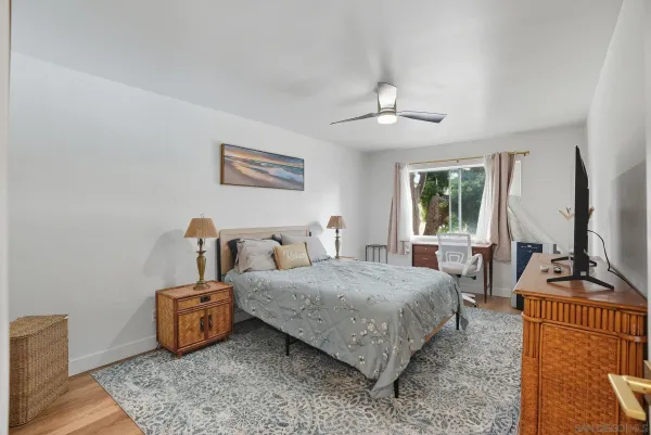 a bedroom with bed and a window