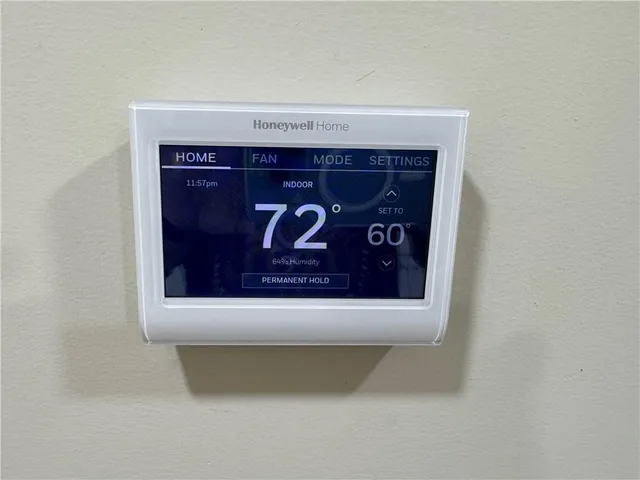 a white toilet sitting next to a bath tub and a shower