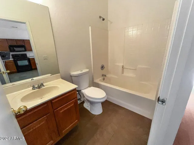 a bathroom with a sink toilet tub and shower