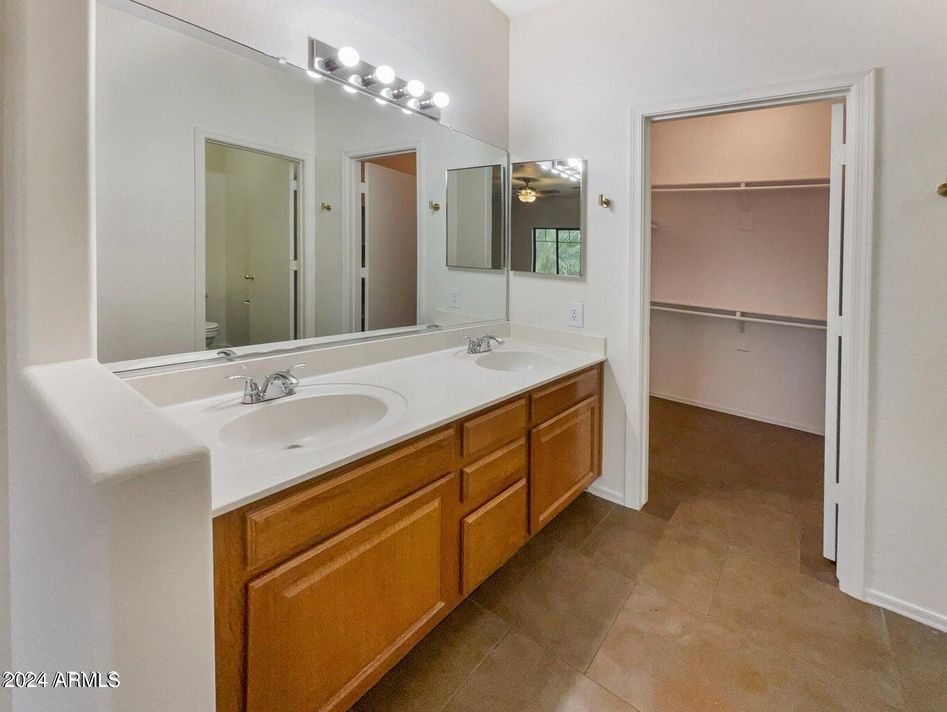 805 South Sycamore, Unit 222 Mesa, AZ 85202 - Photo 5 of 10 a spacious bathroom with a double vanity sink and mirror
