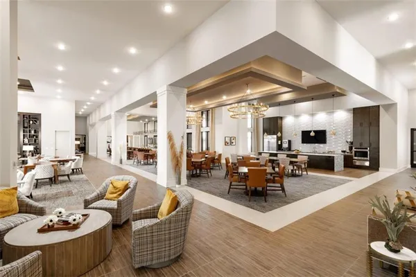 a living room with furniture kitchen view and a wooden floor