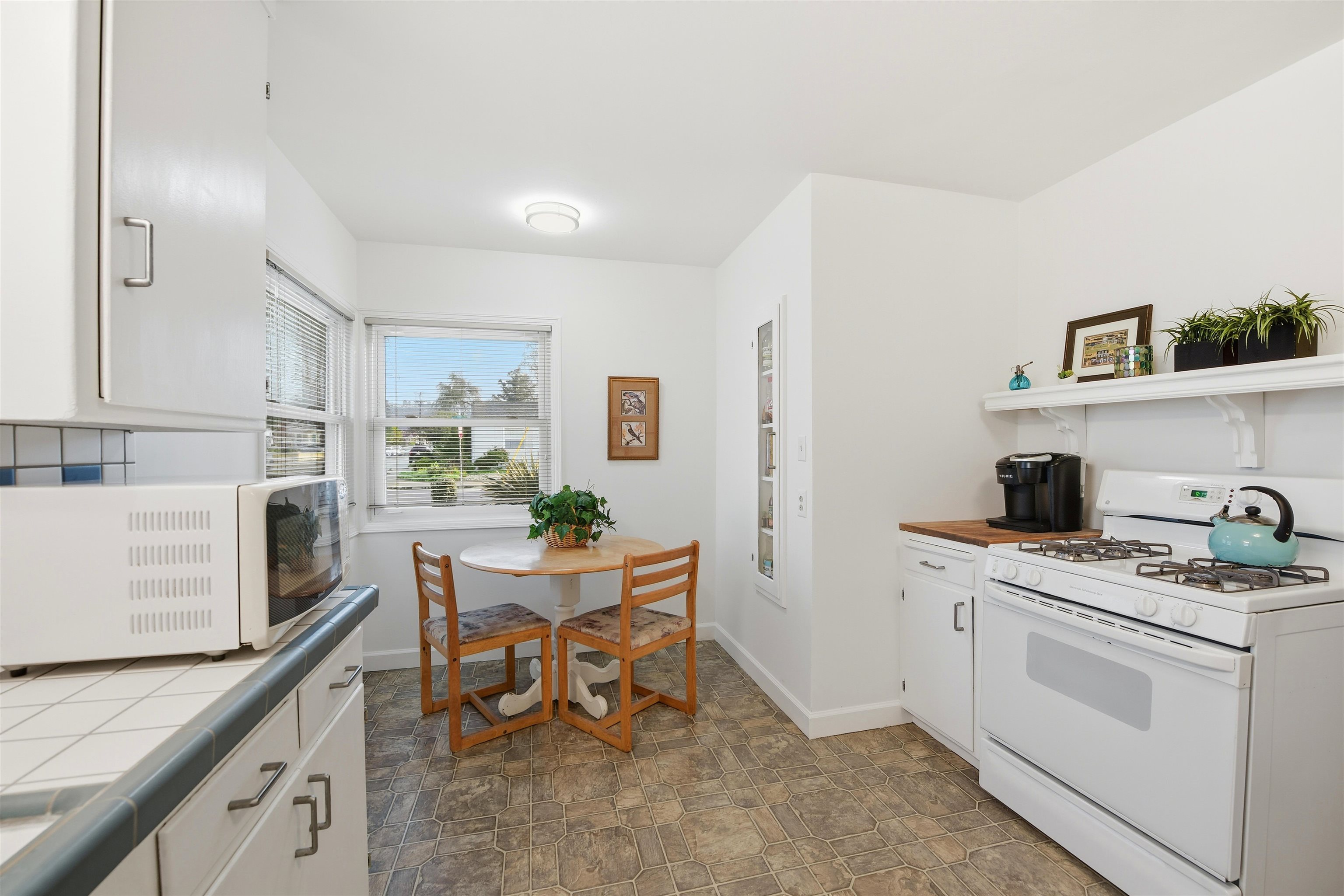 1903 Bradhoff Avenue San Leandro, CA 94577 - Photo 16 of 34 a kitchen that has a lot of cabinets in it and appliances