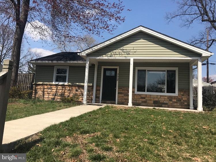 772 223rd Street Pasadena, MD 21122 - Photo 1 of 13 a front view of a house with a yard